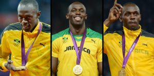 A combination of three pictures made on August 12, 2012 shows Jamaica's sprinter Usain Bolt, posing on the podium of (From L) the 100m, 200m and 4x100m relay races, with the three Olympic champion gold medals he won during the London 2012 Olympic Games.  AFP PHOTO / JOHANNES EISELE        (Photo credit should read JOHANNES EISELE/AFP/GettyImages)