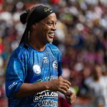 Ronaldinho leads soccer exhibition match in Venezuelas largest slum